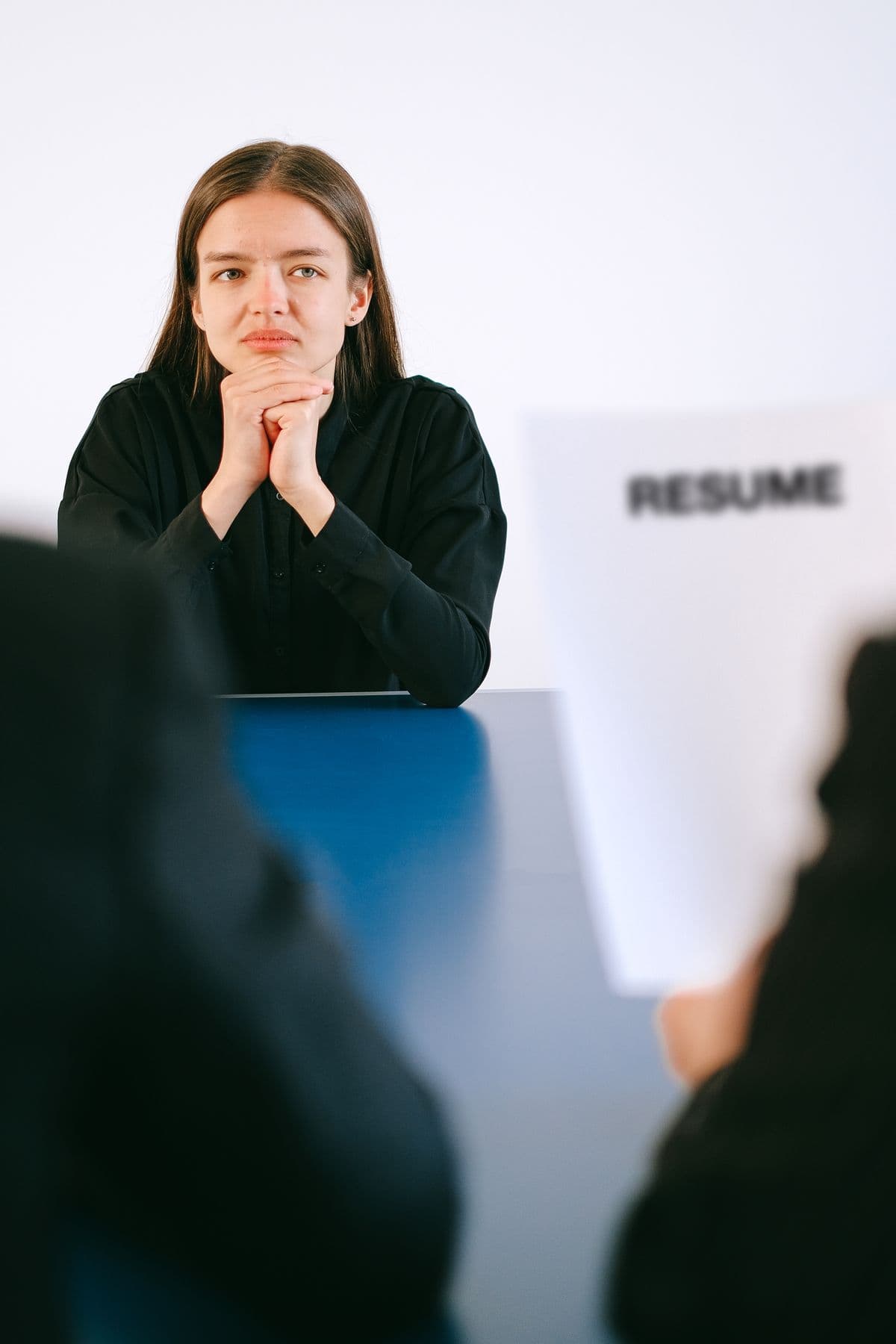 Recruiter reviewing AI candidate screening shortlist on a laptop during a structured hiring workflow